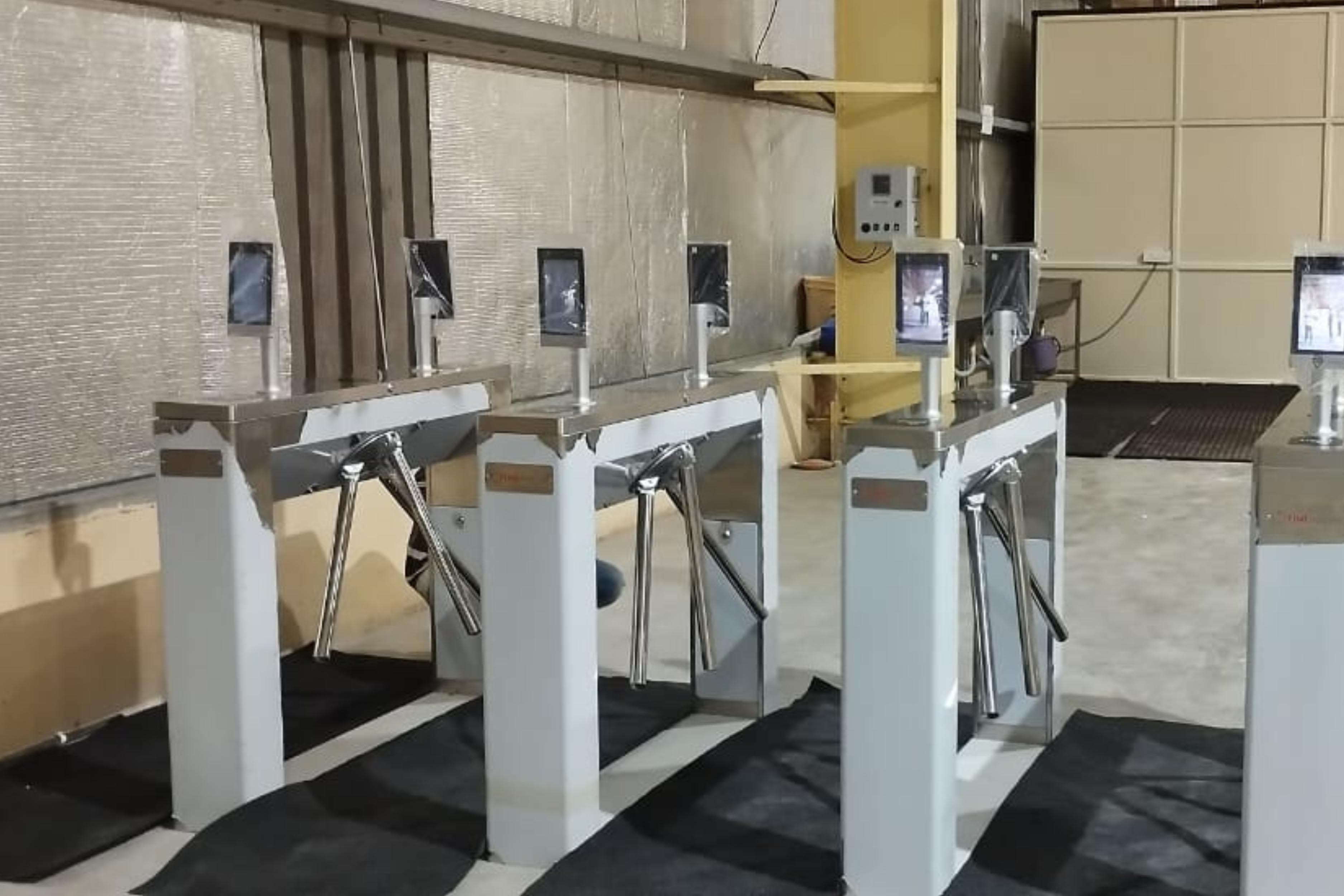 Turnstile lanes controlling pedestrian entry on a reception floor at a Saudi corporate building